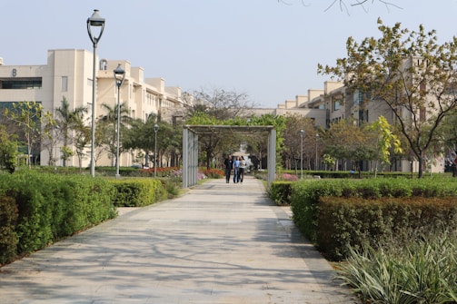 a couple of people that are walking down a path