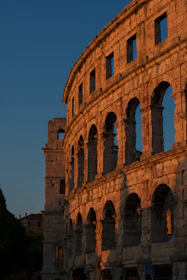 A vibrant photo of Verona’s historic Arena lit by the afternoon sun.