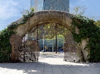 a gate with a clock tower in the background