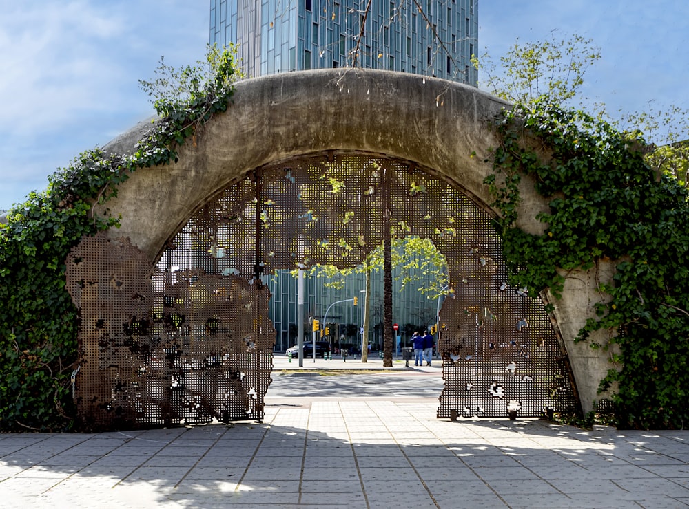 a gate with a clock tower in the background