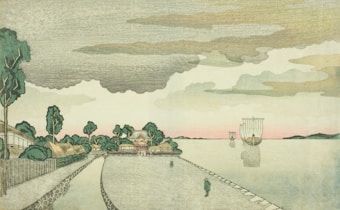 A serene landscape featuring a coastal village with traditional buildings and lush green trees. The path along the water's edge leads to a larger structure in the distance. Two sailing vessels are seen on the calm water under a dramatic sky with thick, layered clouds. A subtle pink hue is visible on the horizon.