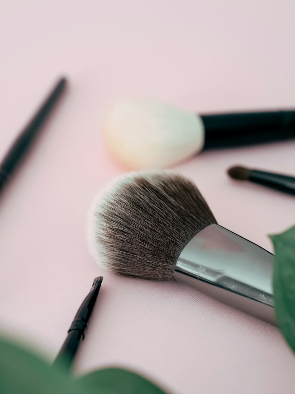 a close up of makeup brushes on a table