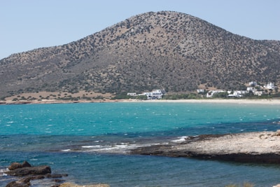 a view of a beach with a mountain in the background