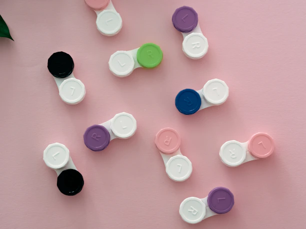 A pair of colorful contact lenses displayed on a clean white surface with soft lighting.