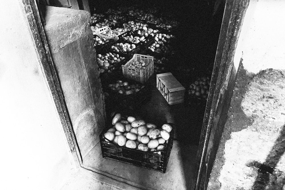 a black and white photo of a bunch of fruit