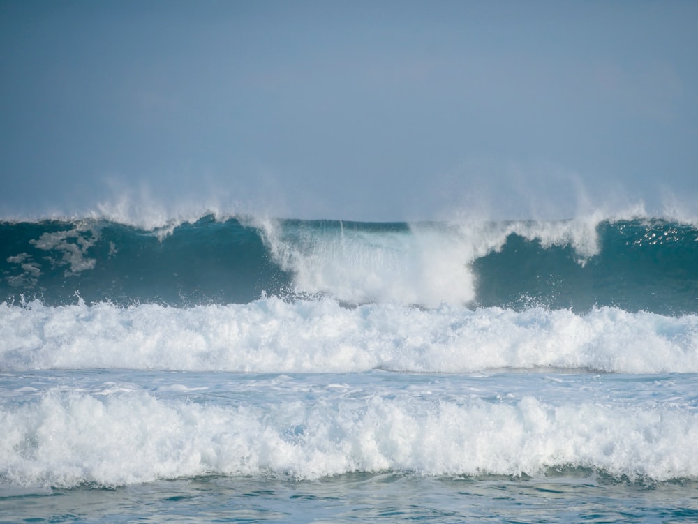 a person riding a wave on top of a surfboard