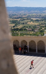 a group of people standing on top of a roof