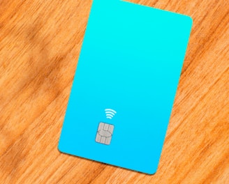 a blue sim card sitting on top of a wooden table