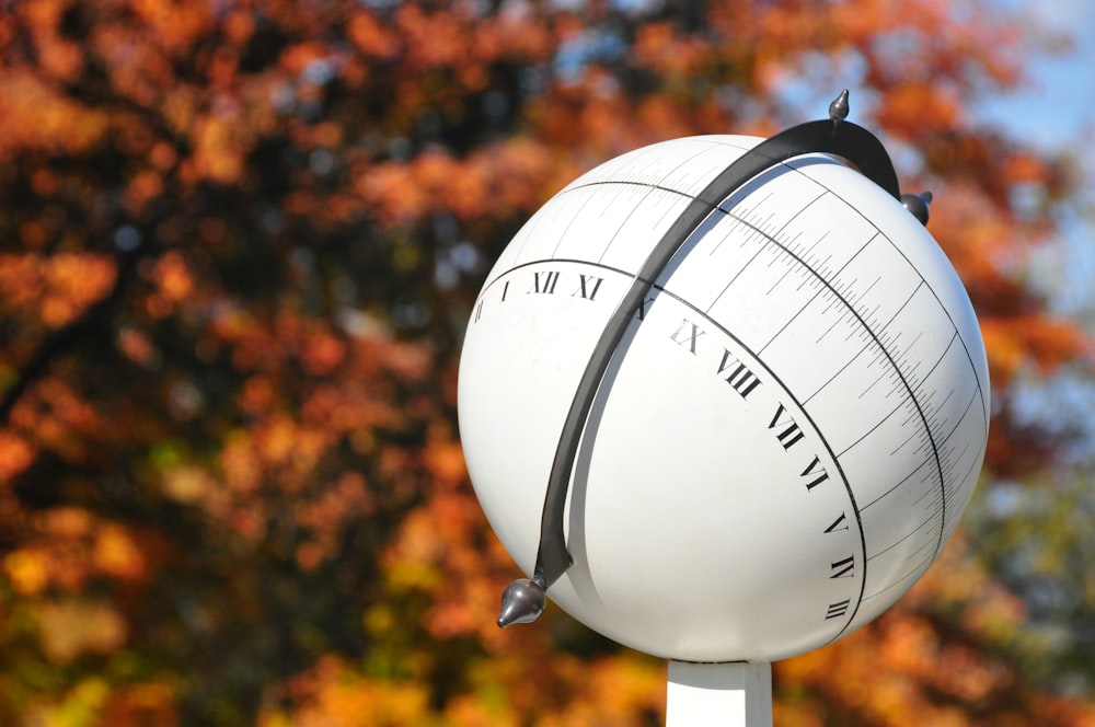 a close up of a large white ball on a pole