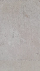 Close-up of a basement wall treated with waterproofing material.