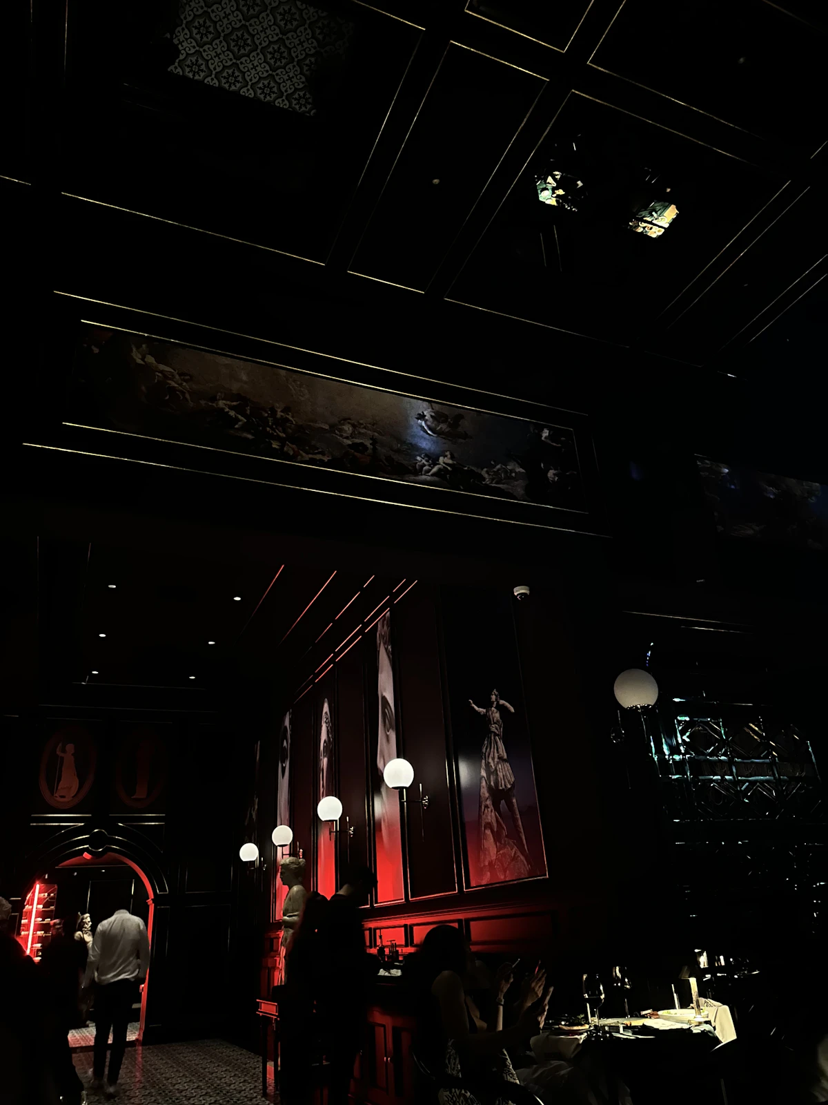 Dimly lit dining room with guests