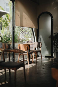A welcoming dietitian's cozy office with plants and natural light.
