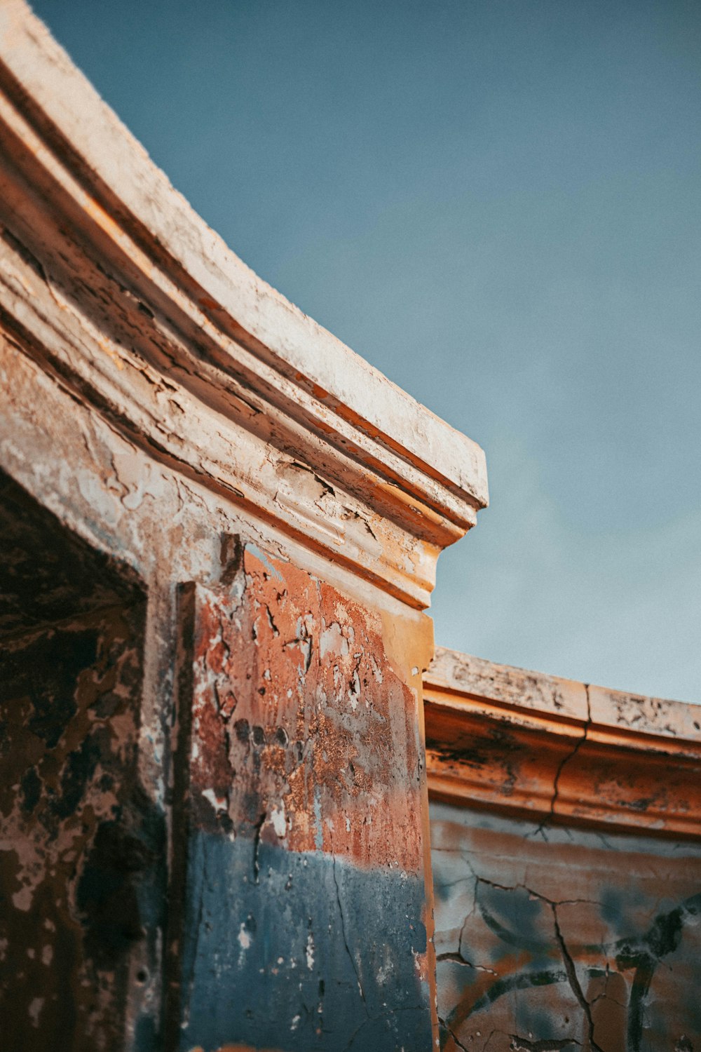 an old building with a clock on the side of it