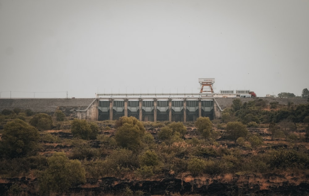 a view of a building in the middle of a field