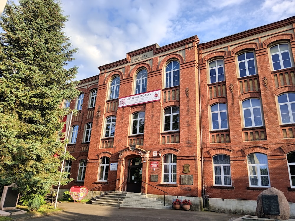 a large red brick building with many windows