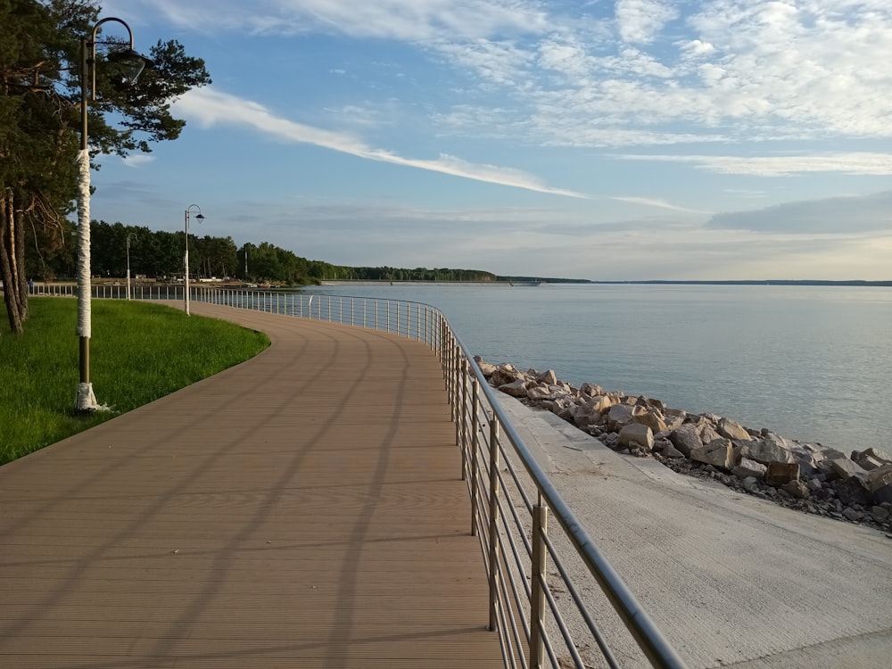 a walkway next to a body of water