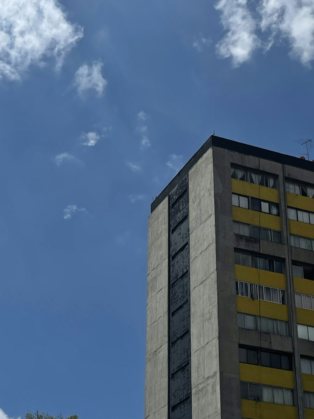 a very tall building with a sky background