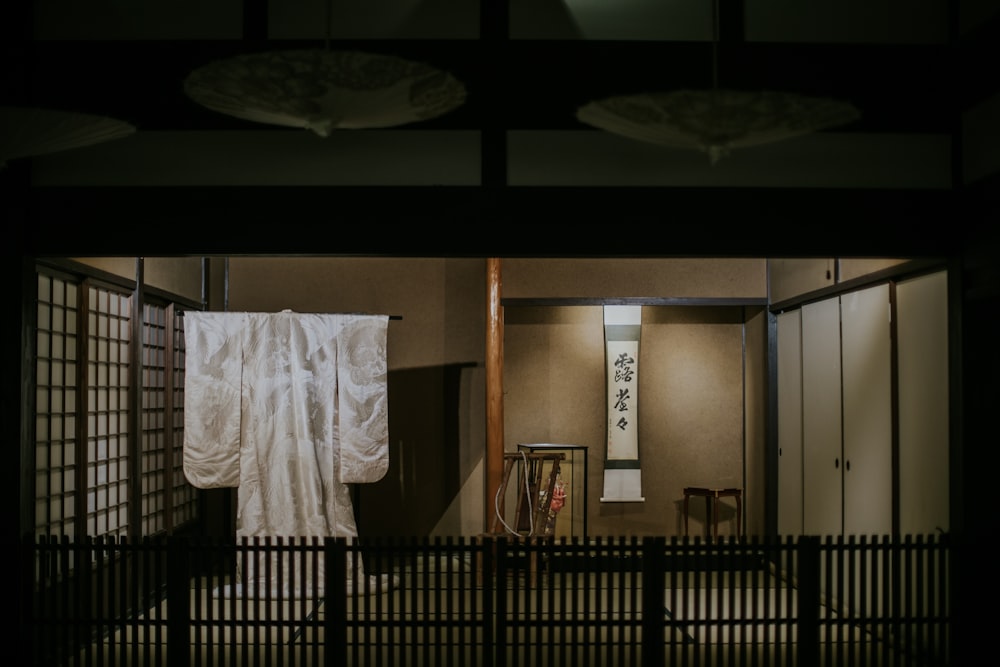 a room with a curtain and a chair in it