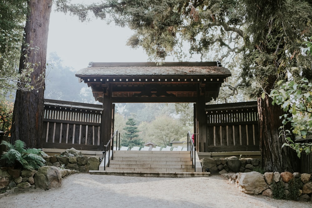 a wooden gate with steps leading up to it