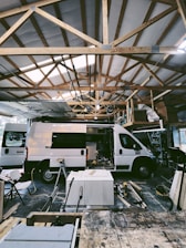 a white van parked inside of a building under construction