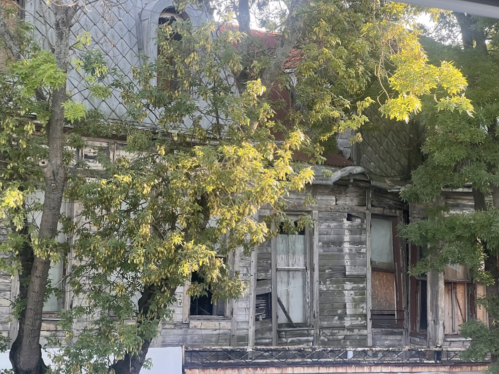 an old run down building with a broken window