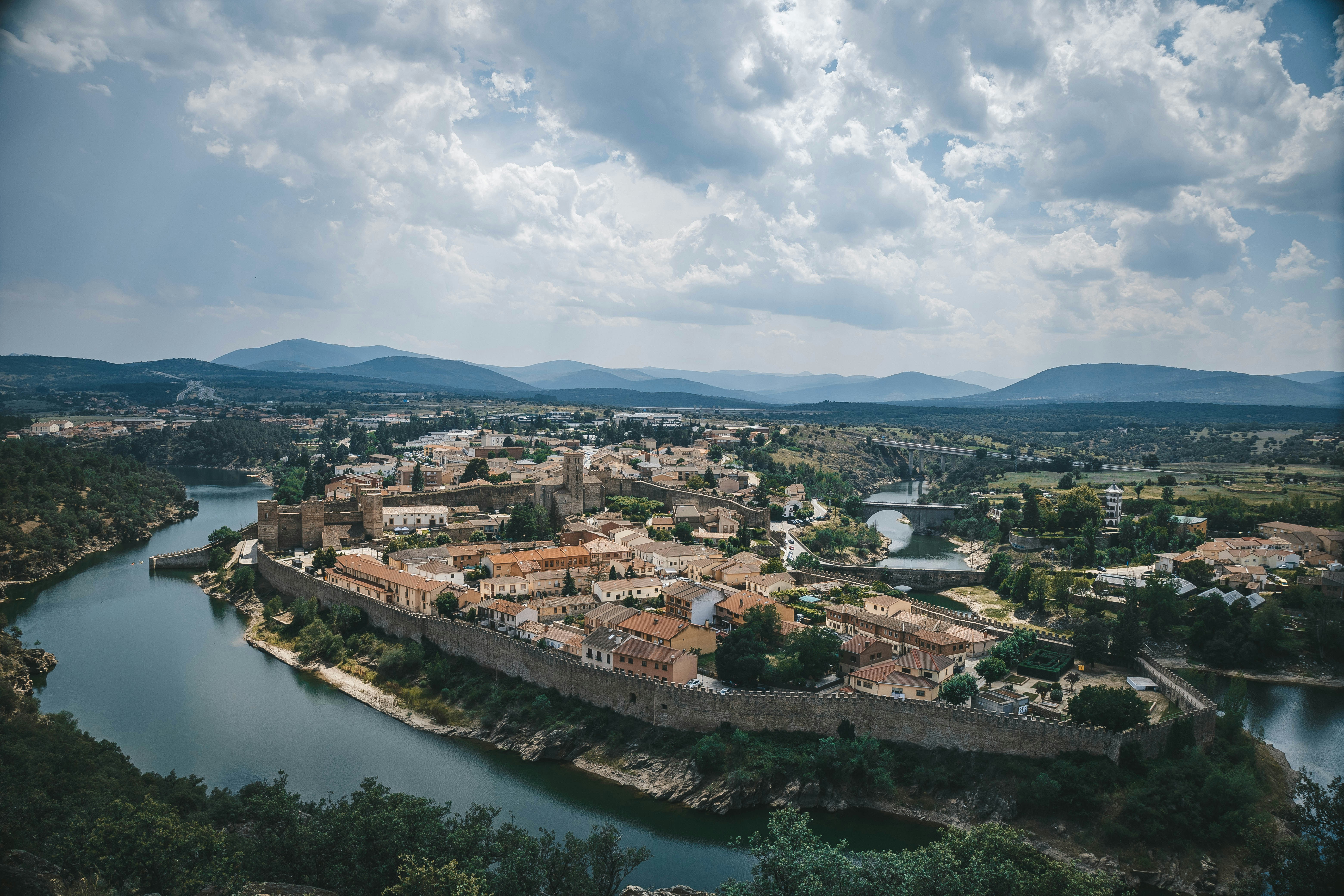 an aerial view of a city with a river running through it