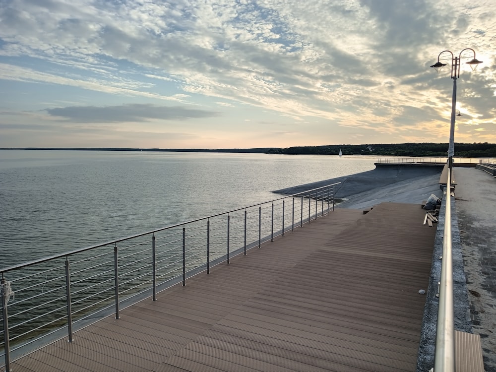 a pier with a bench on the side of it