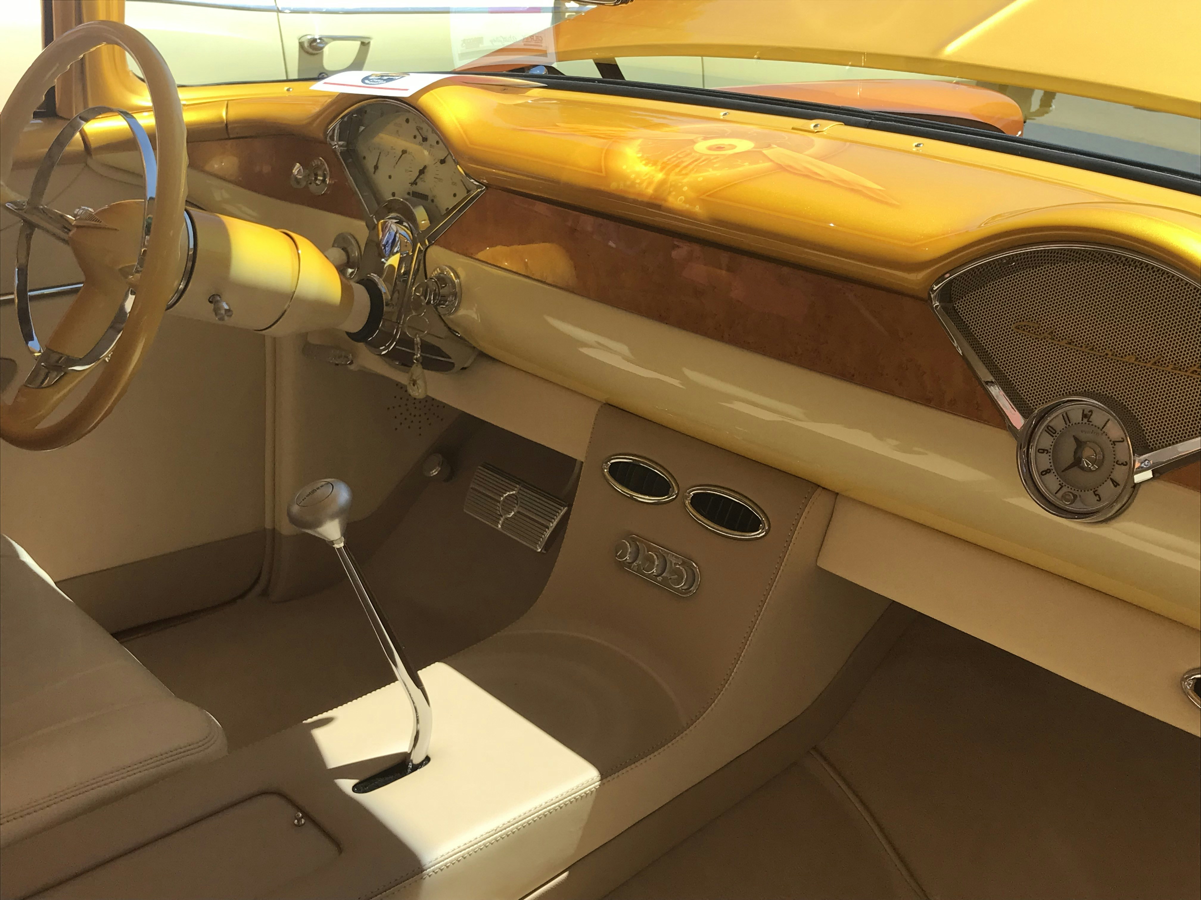 the interior of a car with a steering wheel and dashboard