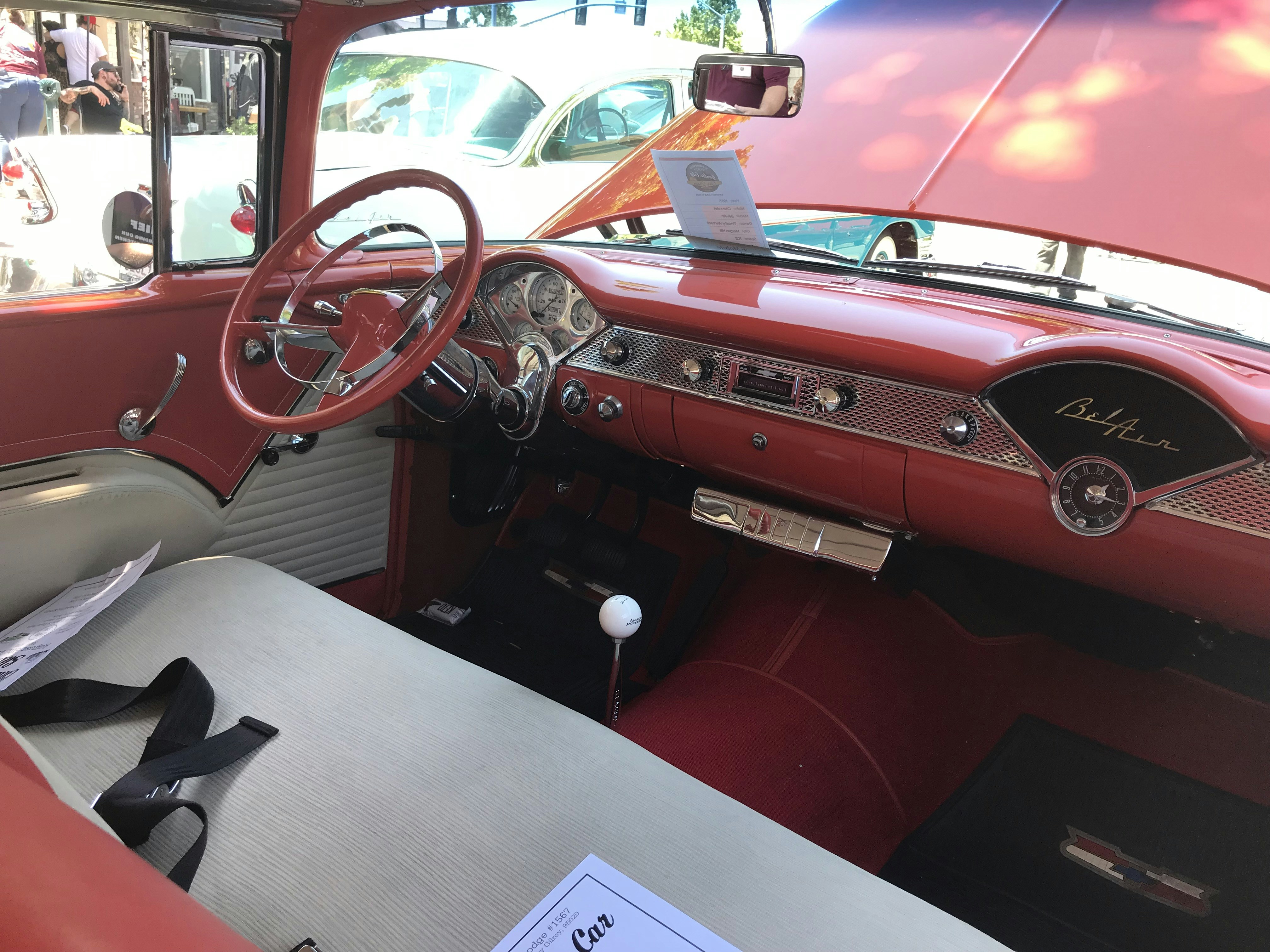 the interior of a car with a steering wheel and dashboard