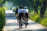 Kids wearing helmets and biking together on a sunny day.