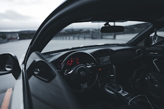 Close-up of a sleek car interior with a focus on the dashboard.