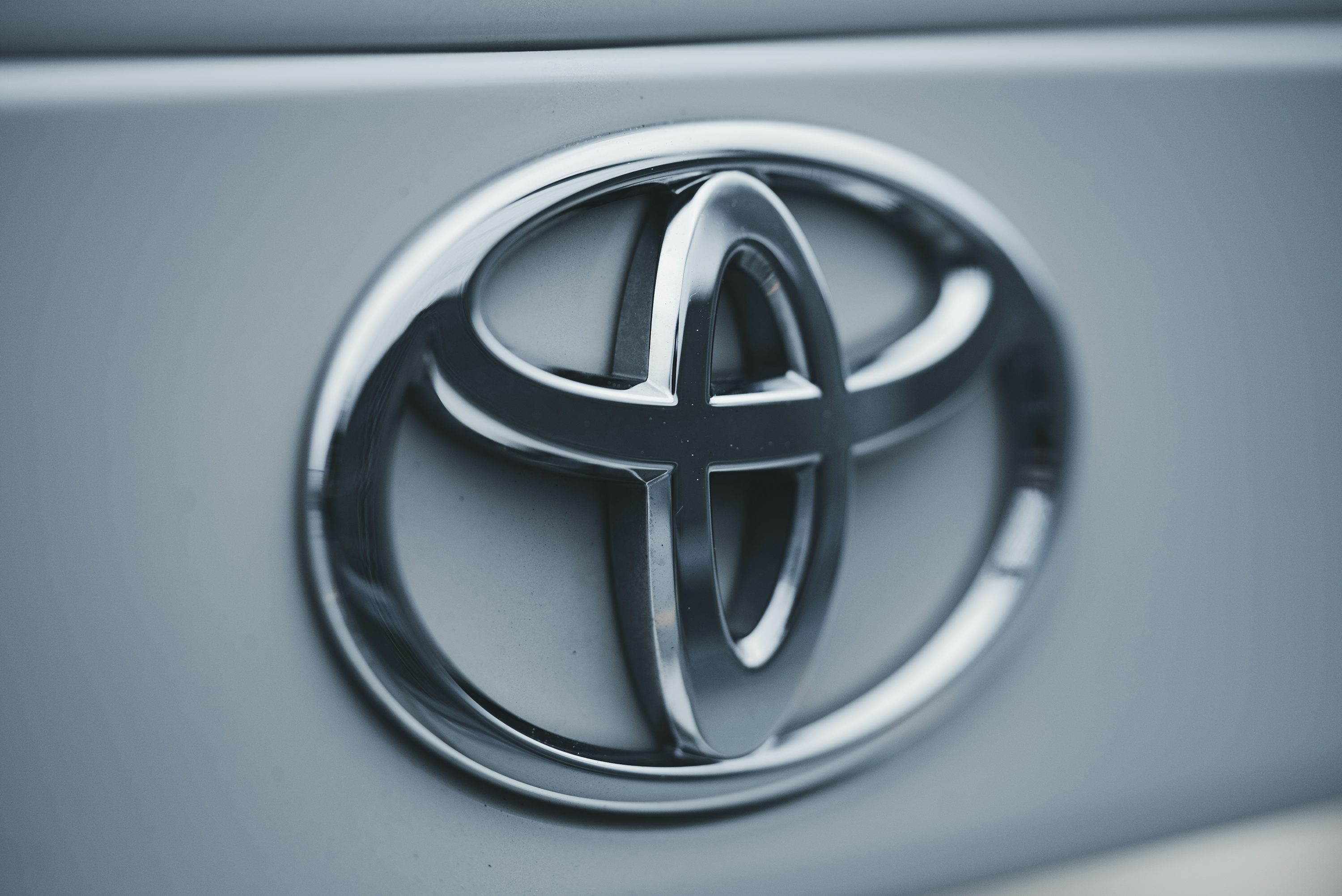 a close up of a toyota emblem on a car