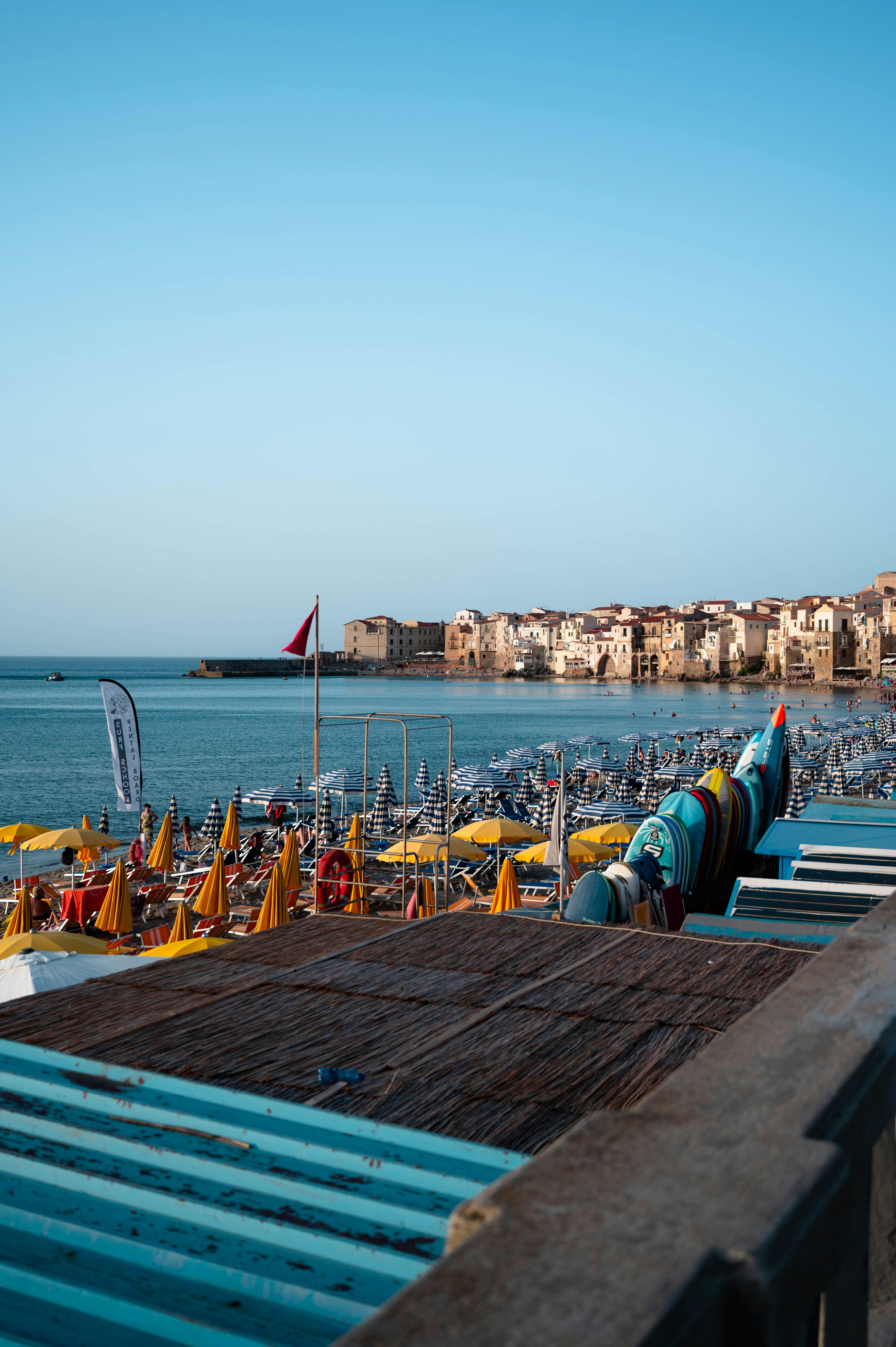 a view of a beach with a lot of umbrellas