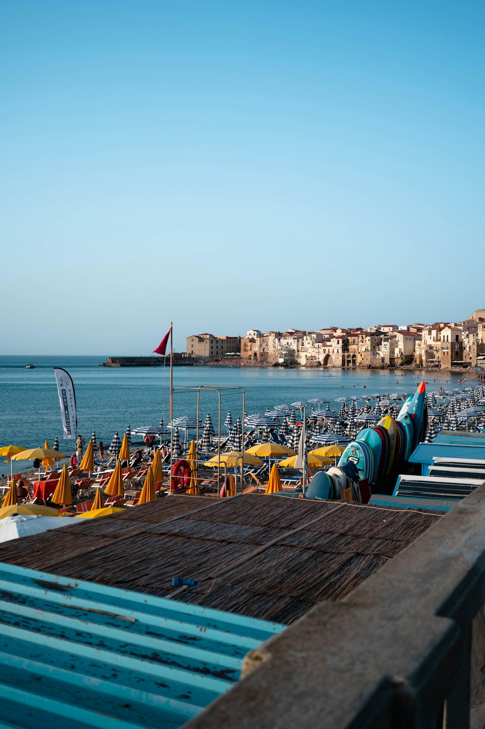 a view of a beach with a lot of umbrellas