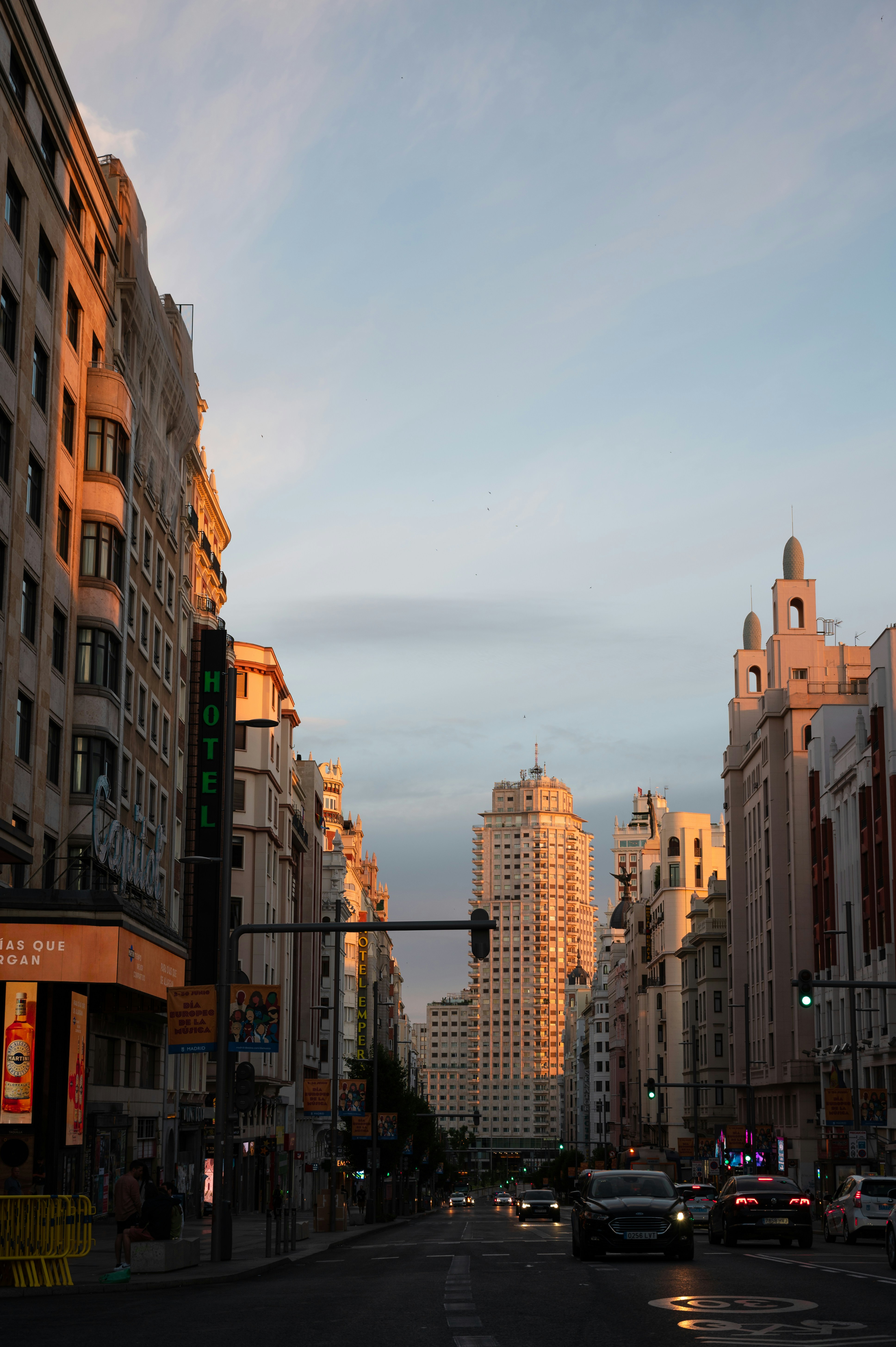 a city street filled with lots of tall buildings