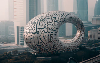 a large white sculpture in the middle of a city