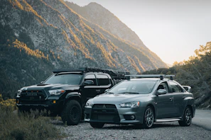 A Mitsubishi rental car with an Indonesian driver ready to start a journey on a scenic road.