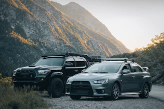 A Mitsubishi rental car with an Indonesian driver ready to start a journey on a scenic road.