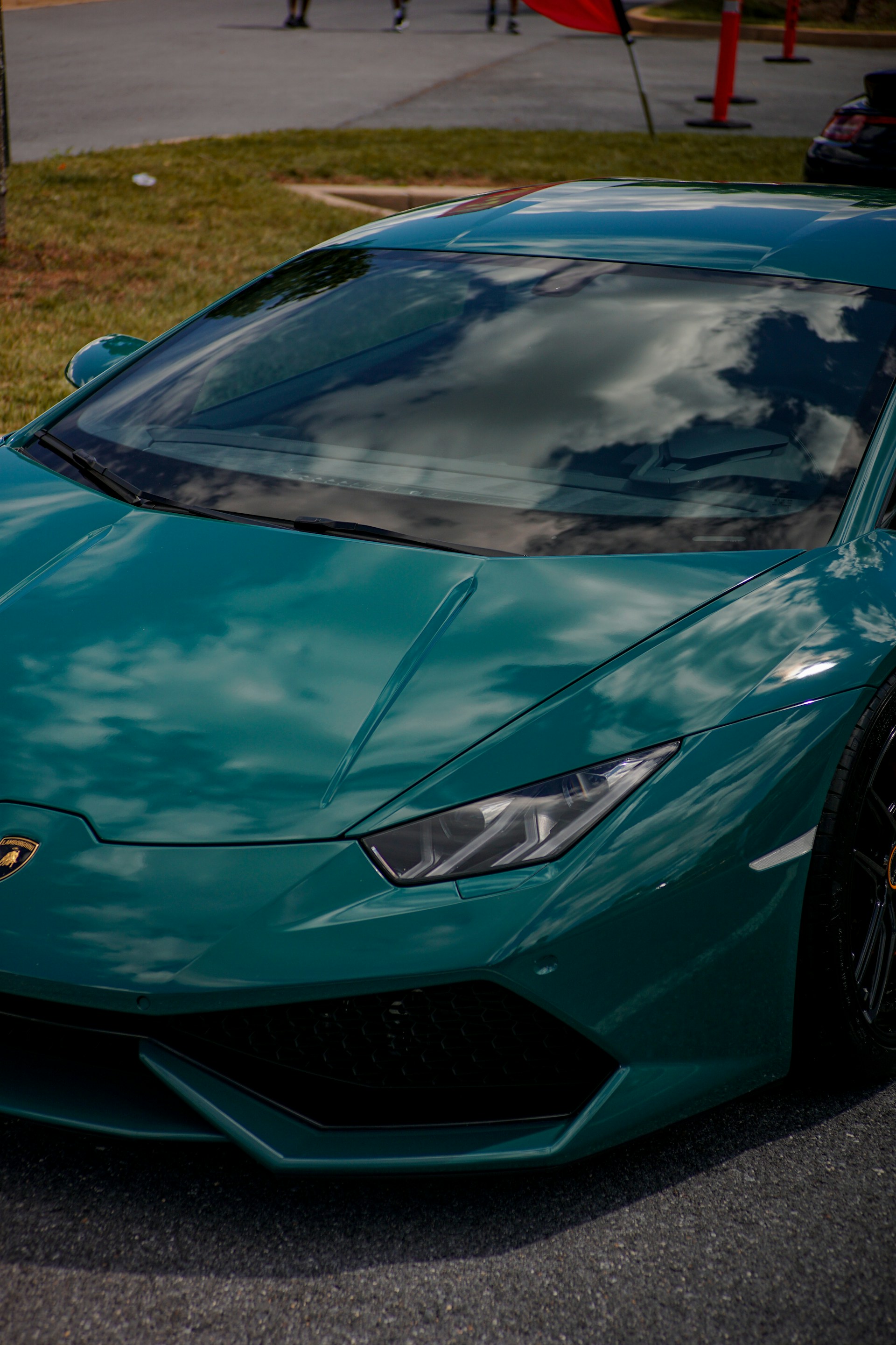a blue sports car parked in a parking lot
