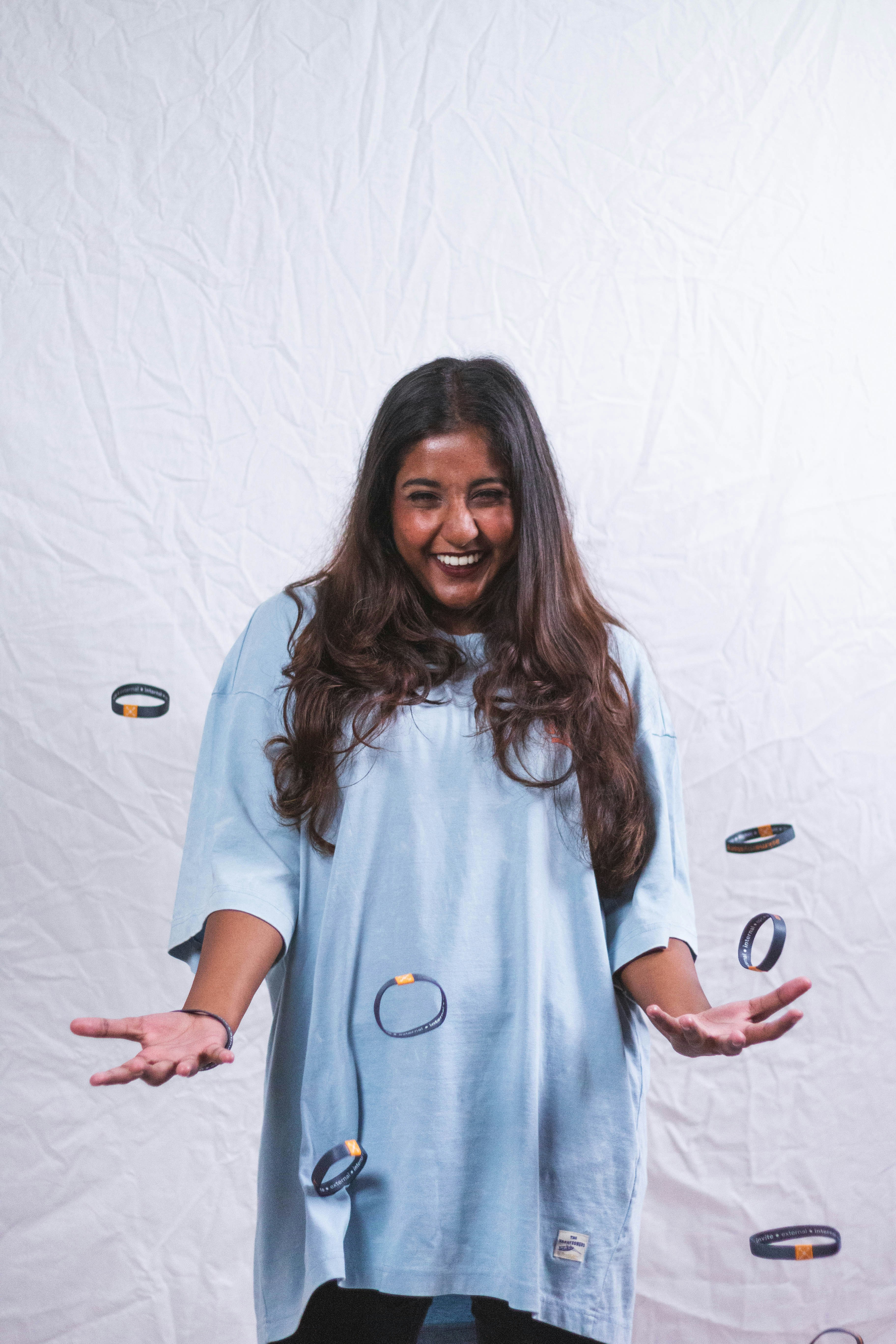 A woman standing in front of a white backdrop photo – Free Love Image ...