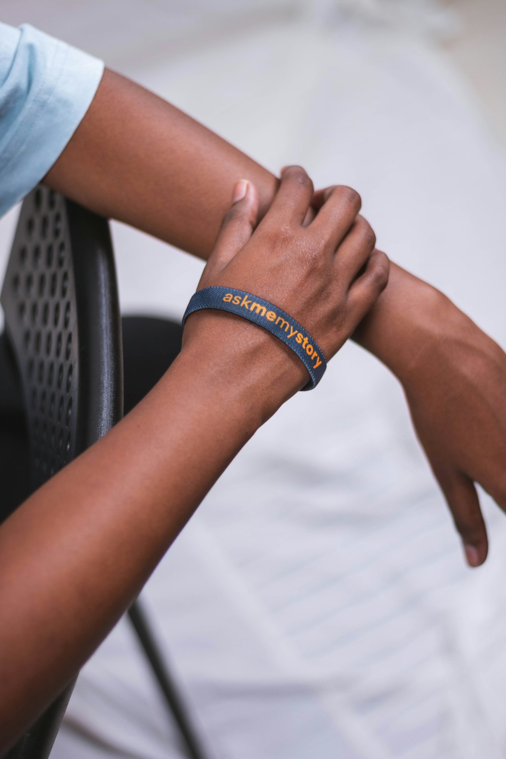 a person wearing a bracelet with a name on it