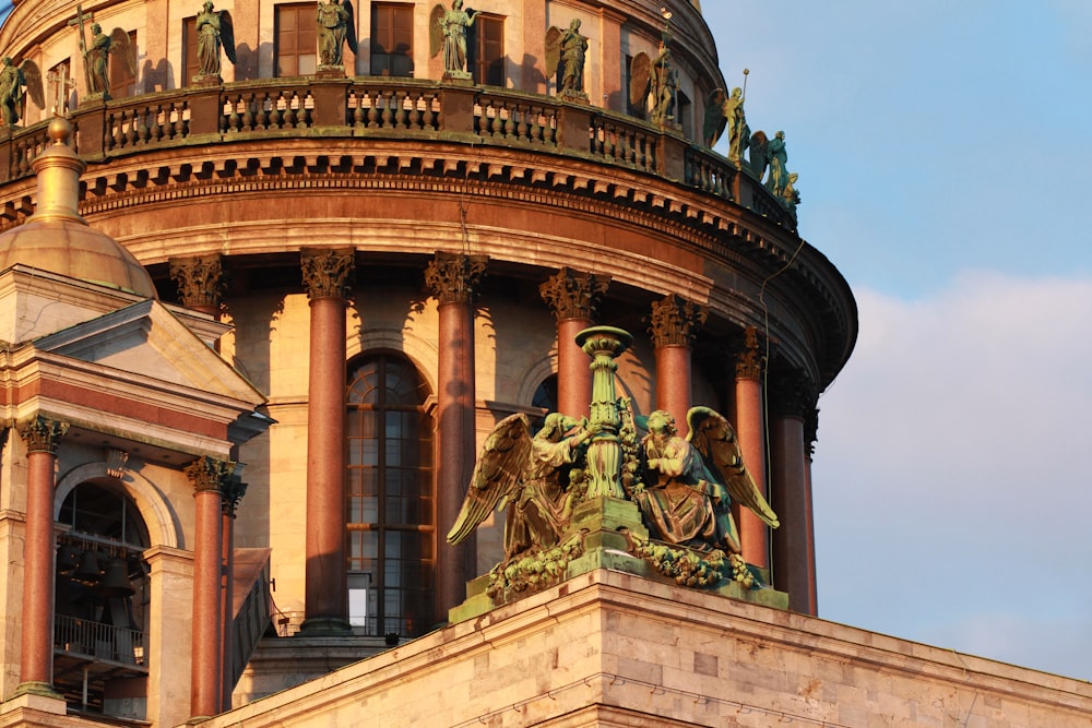 a large building with a statue on top of it