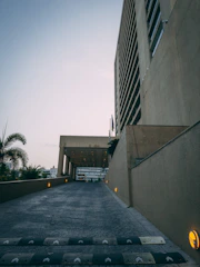 A smooth, freshly poured concrete driveway leading up to a modern Hawaiian home in Waianae.