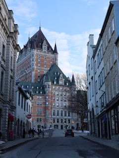 a city street lined with tall buildings and tall towers