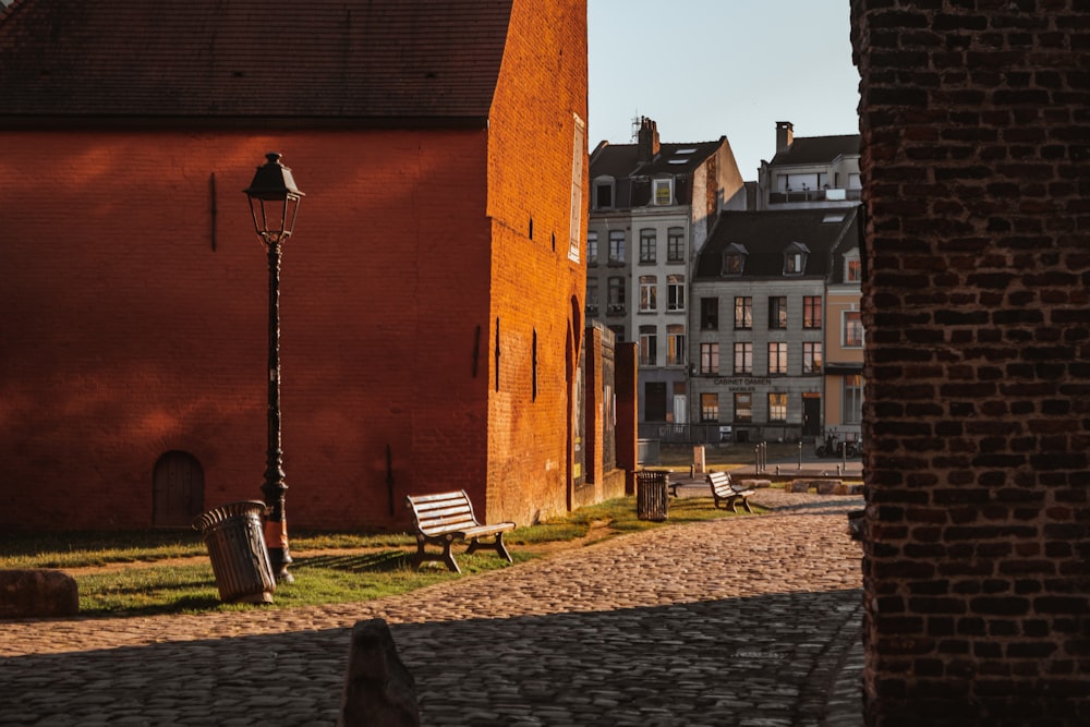 a cobblestone street lined with brick buildings