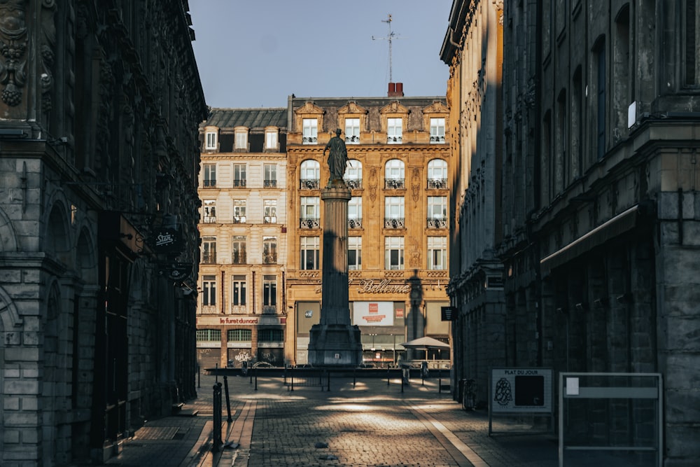 a city street with a clock tower in the middle of it