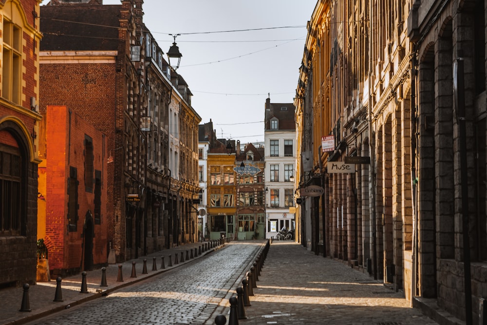 a cobblestone street lined with old buildings