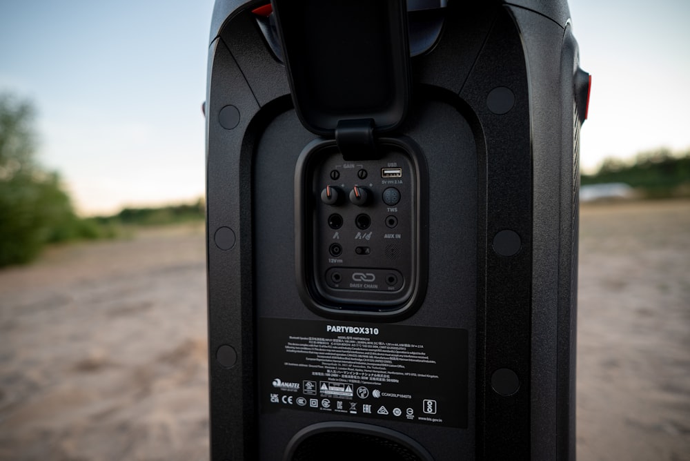 a close up of a speaker with a sky background