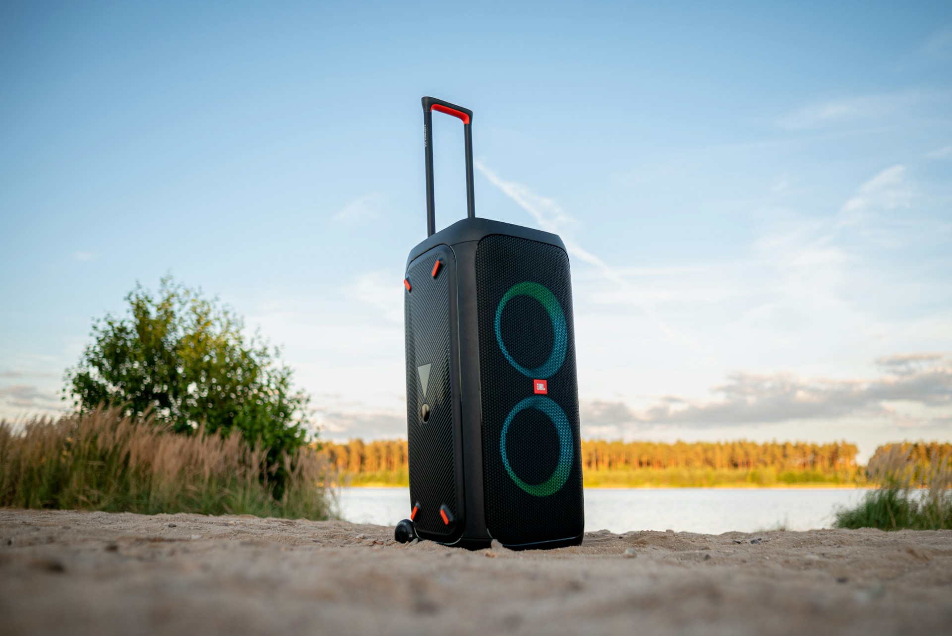 a piece of luggage sitting on top of a sandy beach