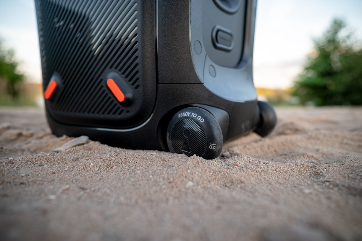 a close up of a black and orange suitcase